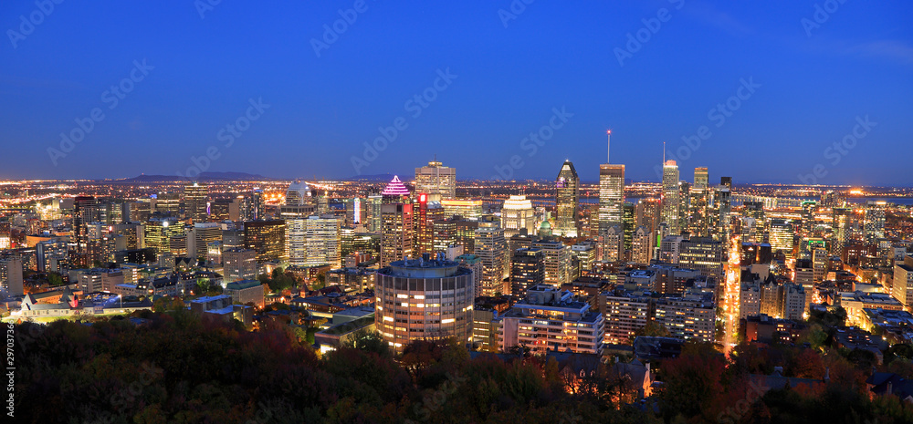 Montreal skyline illuminated at dusk, aerial view, Canada