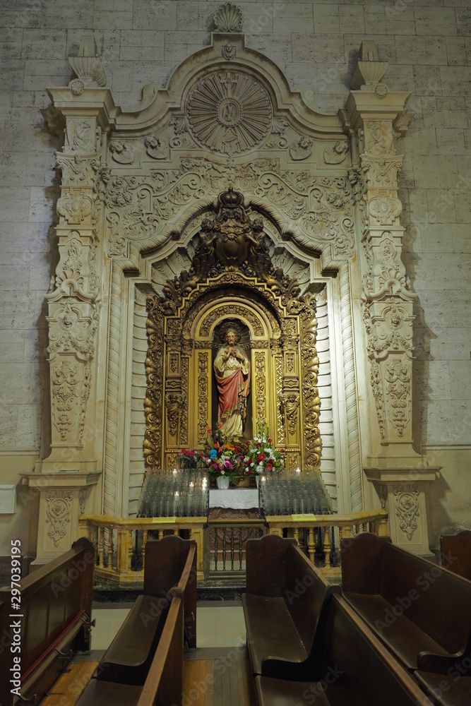 jesus statue inside a church alter