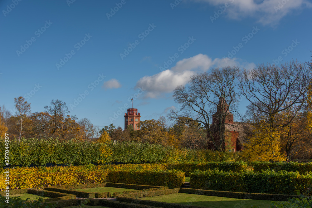 Famous tower and church at autumn on a hill in a park in Stockholm
