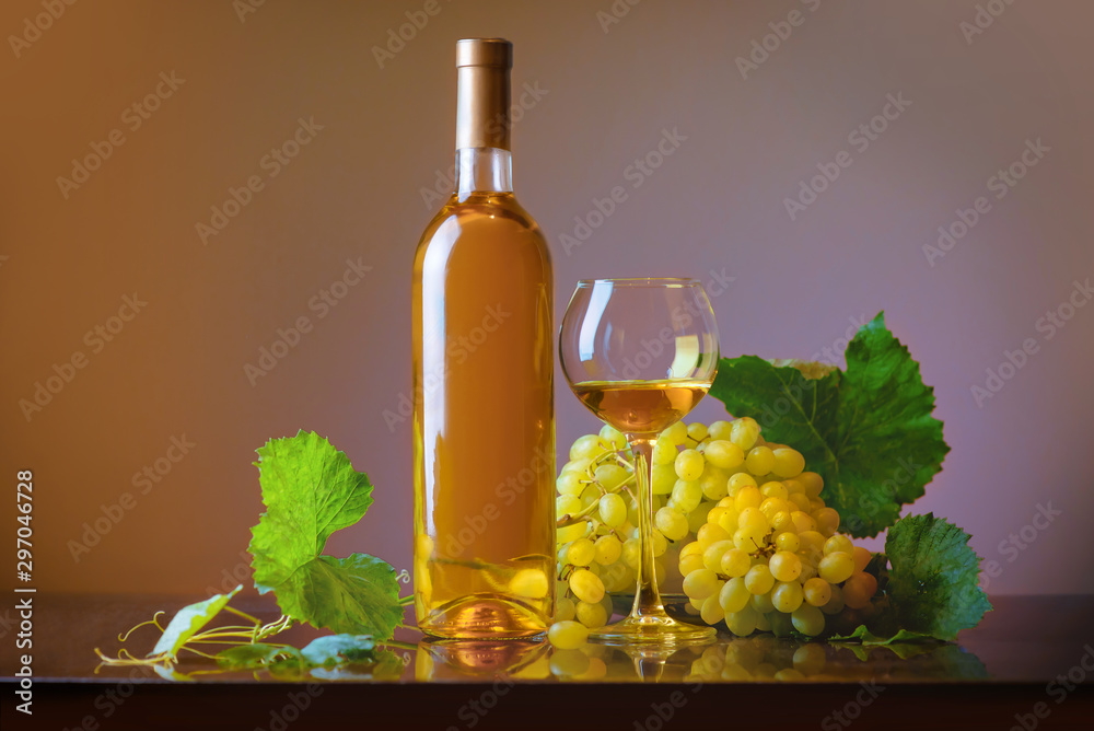 Fototapeta premium Wine. Bottle and glass of white wine with ripe grapes still life. White wine on a light background. Border art design.