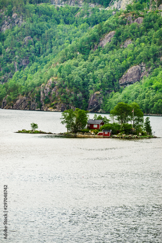 Fototapeta premium Fjord landscape with hytte on isle, Norway