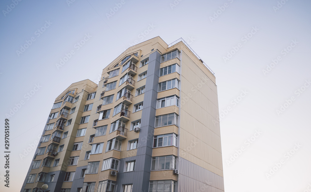 Modern apartment buildings on a sunny day with a blue sky. Facade of a modern apartment building. residential building modern apartment condominium architecture Modern apartment buildings on a sunny day with a blue sky. Facade of a modern apartment building. residential building modern apartment condominium architecture