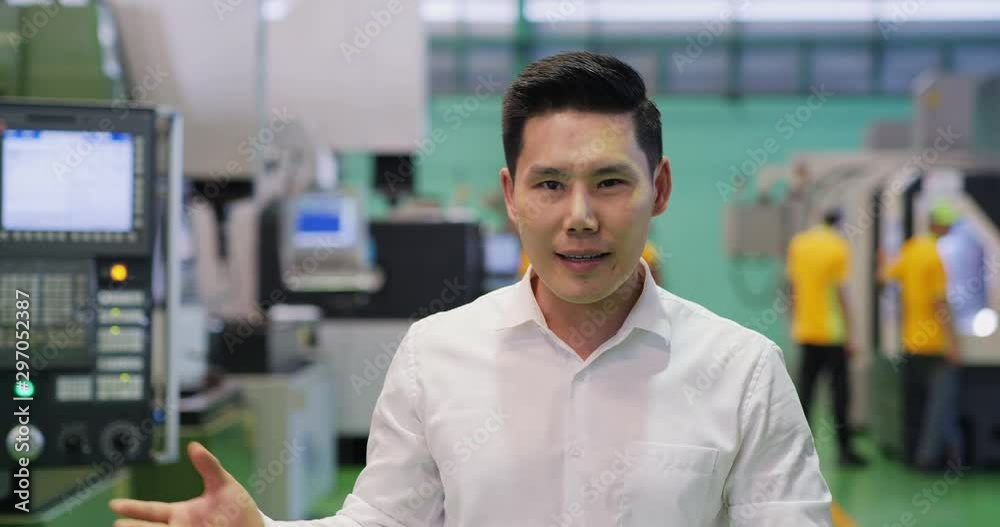 Business man speaking to camera at factory. Man was interview about his business. Business man speaking to camera at factory. Man was interview about his business.