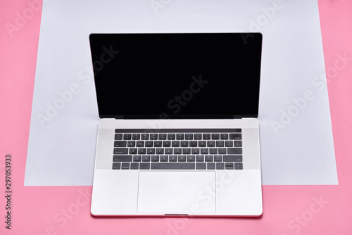 Front view of the laptop is on the work table, concrete background, clipping path inside