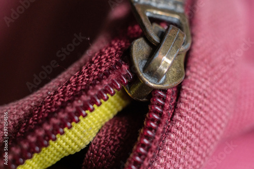 macro shot of a color zipper on a color textile accessories, locking and unlock