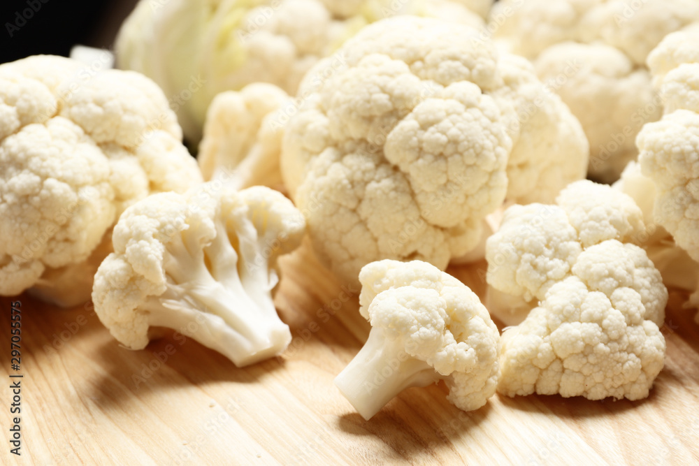 Fresh cauliflower close-up on a brown wooden table Fresh cauliflower close-up on a brown wooden table