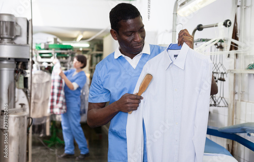 Man working in dry cleaner