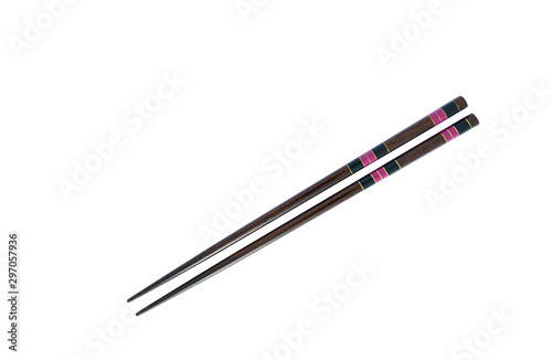 Pair of brown chopsticks isolated on on white background
