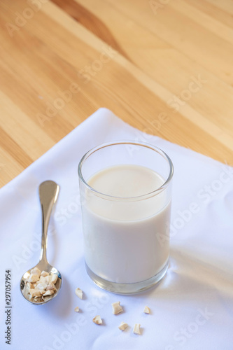 glass of milk on wooden and White cloth