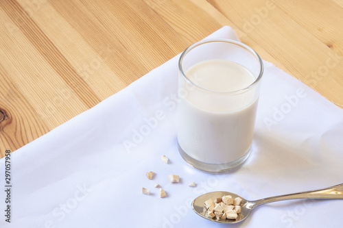 glass of milk on wooden and White cloth