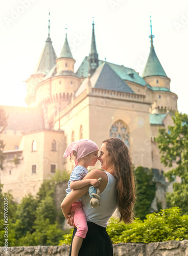 kiss each other on the background of a beautiful castle.