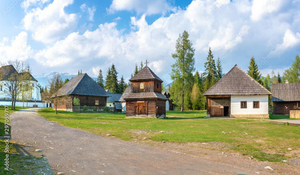 Old traditional houses and wooden belfry of village Pribylina in Liptov region (SLOVAKIA) - PANORAMA