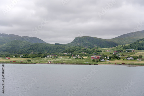 houses on blossoming meadows near Reinsnes, Norway