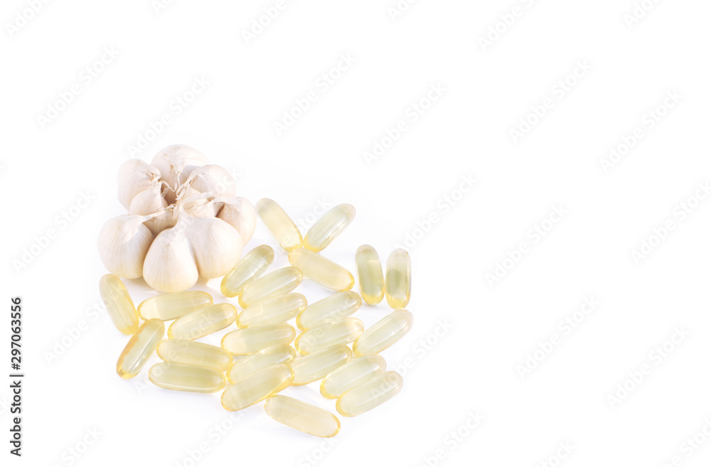 Garlic oil capsule on white background. Can used for concepts of healthy vitamin herbal natural medicine plant. copy space for text on right. Garlic oil capsule on white background. Can used for concepts of healthy vitamin herbal natural medicine plant. copy space for text on right.