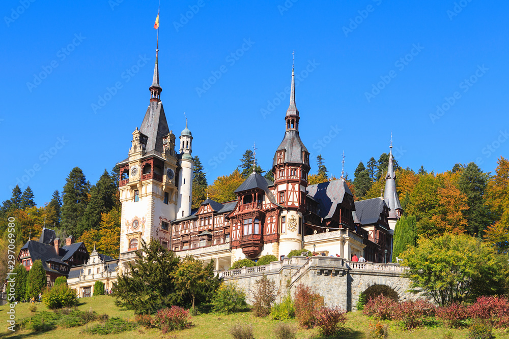 Peles Castle, Romania. Beautiful famous royal castle and ornamental garden in Sinaia landmark of Carpathian Mountains Peles Castle, Romania. Beautiful famous royal castle and ornamental garden in Sinaia landmark of Carpathian Mountains