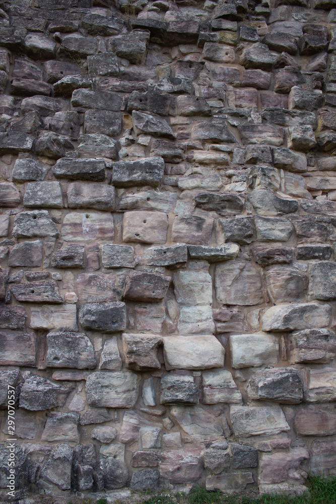 Texture of a stone wall. Old castle stone wall texture background. Texture of a stone wall. Old castle stone wall texture background.