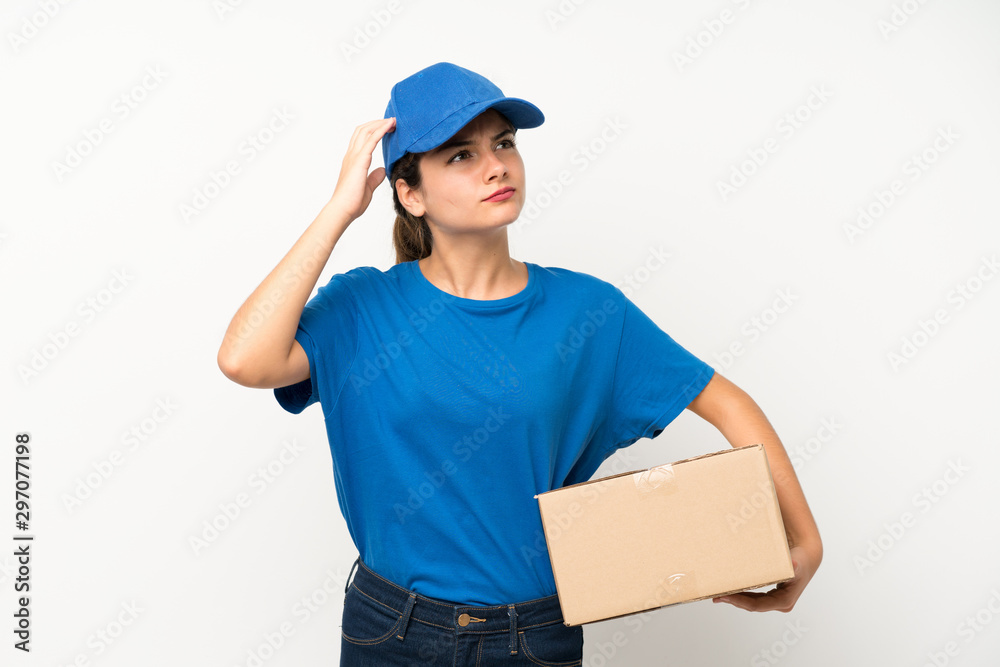 Young delivery girl over isolated white background having doubts and with confuse face expression Young delivery girl over isolated white background having doubts and with confuse face expression