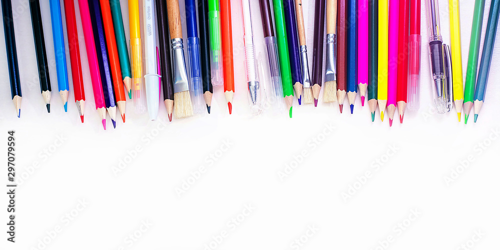 A lot of multi-colored school and office supplies on a white background - Banner. Back to school. Copyspace for text
