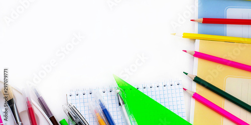 A lot of multi-colored school and office supplies on a white background - Banner. Back to school. Copyspace for text