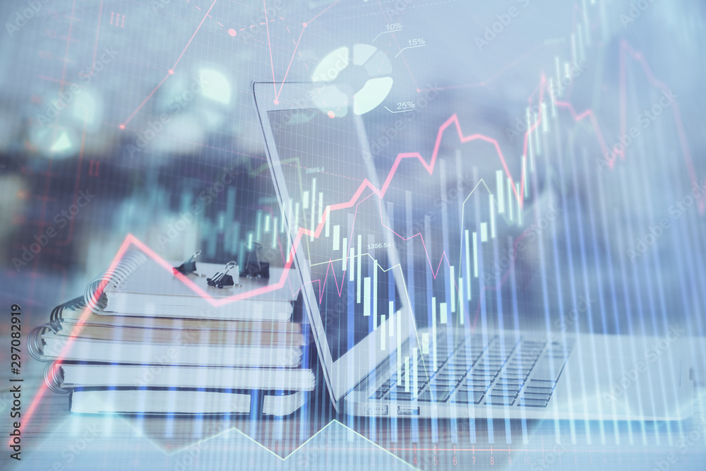 Forex Chart hologram on table with computer background. Multi exposure. Concept of financial markets. Forex Chart hologram on table with computer background. Multi exposure. Concept of financial markets.