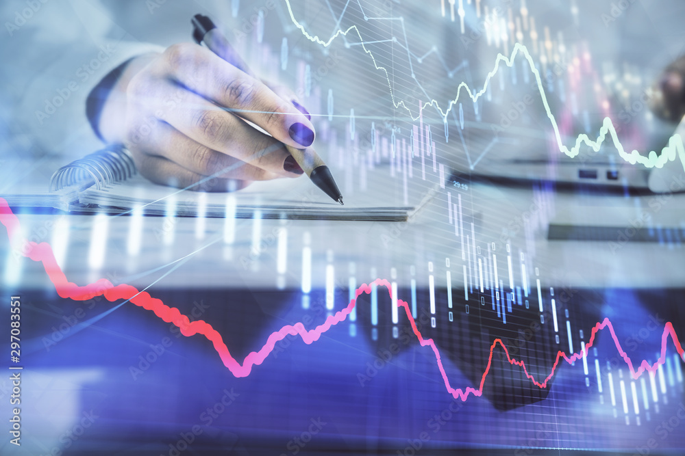Double exposure of woman's hands making notes with forex graph hologram. Concept technical analysis. Double exposure of woman's hands making notes with forex graph hologram. Concept technical analysis.
