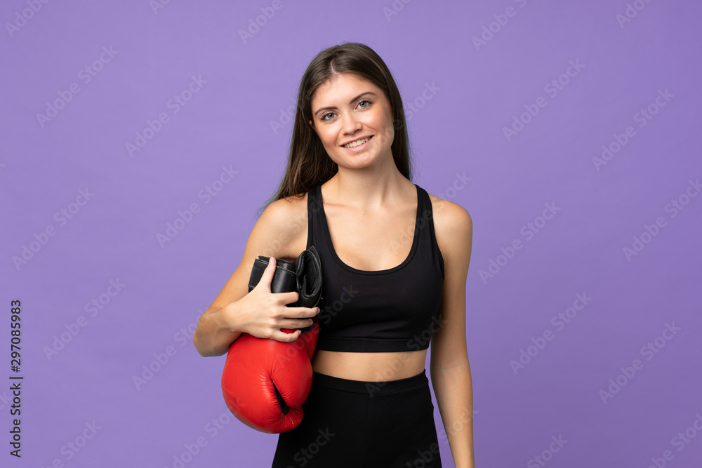 Young girl woman over isolated background with boxing gloves