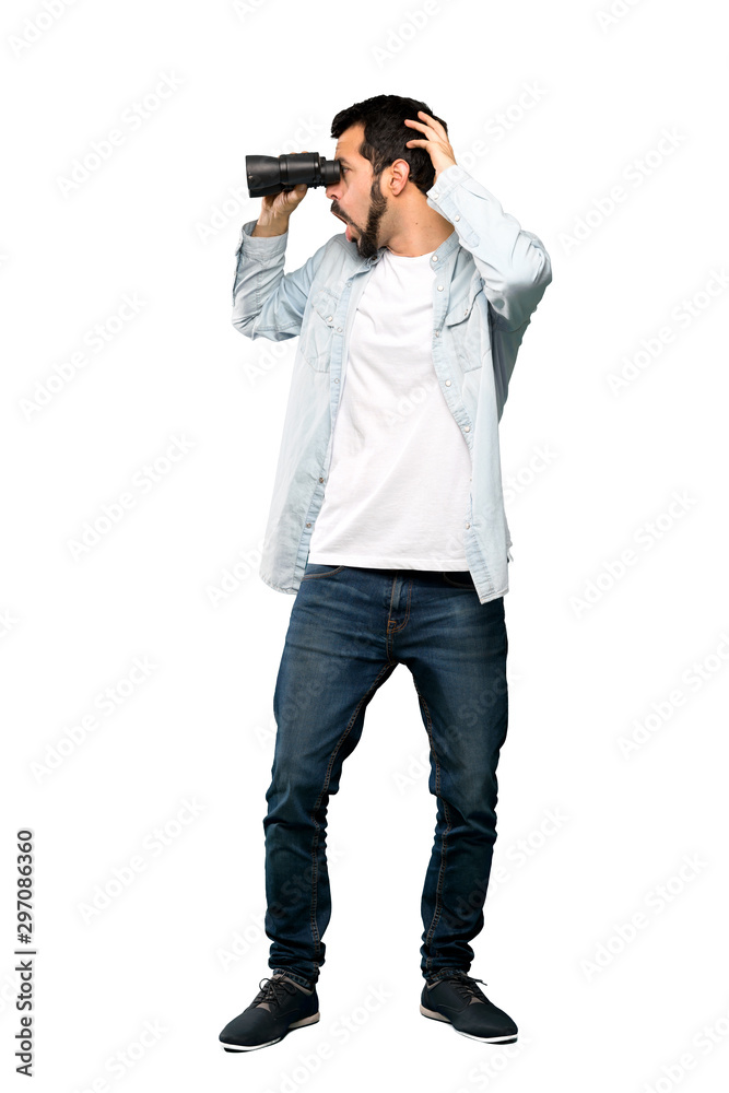 Handsome man with beard with binoculars. Handsome man with beard with binoculars.