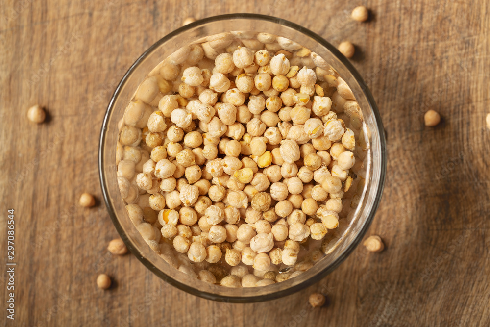 Chickpea, dry chickpeas beans in water in bowl, legume chickpea Chickpea, dry chickpeas beans in water in bowl, legume chickpea