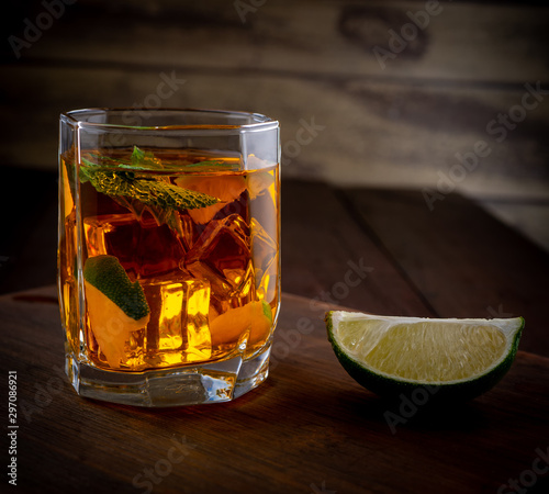 Alcoholic cocktail with whiskey lime and ice