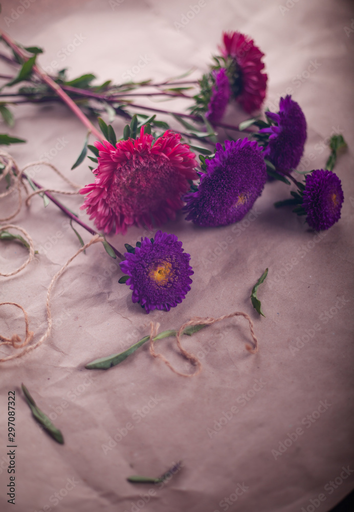 cut violet and pink asters are collected in a bouquet cut violet and pink asters are collected in a bouquet