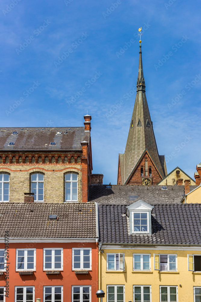 Obraz premium Colorful houses and church tower in Flensburg, Germany