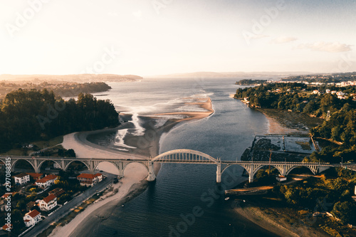 Puente con atardecer en Galicia desde drone