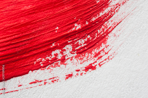 Red abstract brush stroke on white background