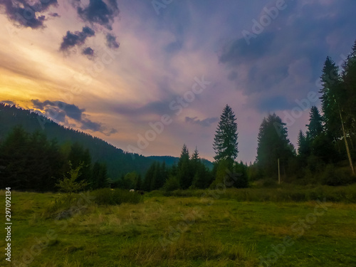 Landscape with Carpathian mountains during the sunset with amazing sunlight