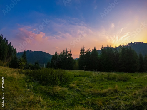 Landscape with Carpathian mountains during the sunset with amazing sunlight