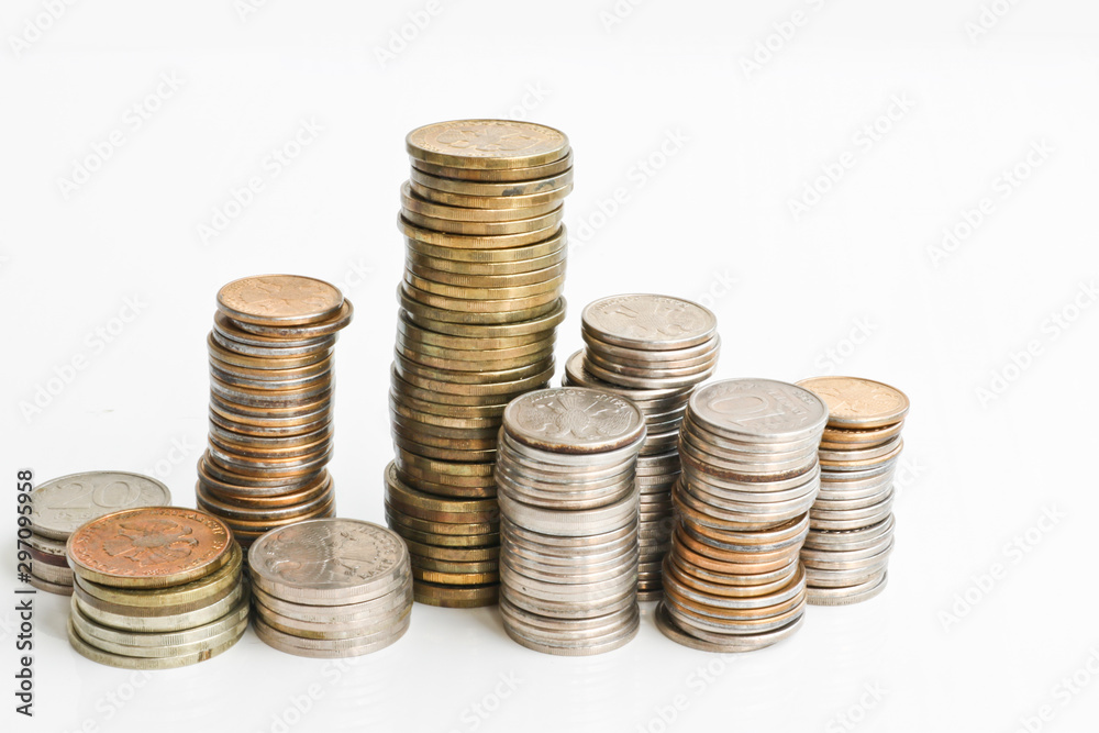 Columns of coins of Russian rubles on a white background. Outdated Russian currency. Double-headed eagle on the back of coins. Copy Columns of coins of Russian rubles on a white background. Outdated Russian currency. Double-headed eagle on the back of coins. Copy