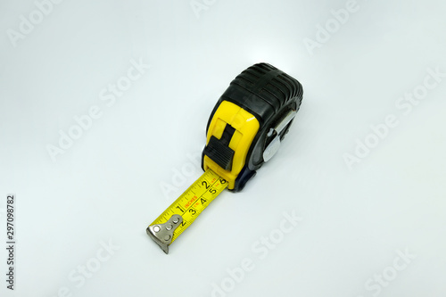 Yellow measuring tape isolated cut out on white background