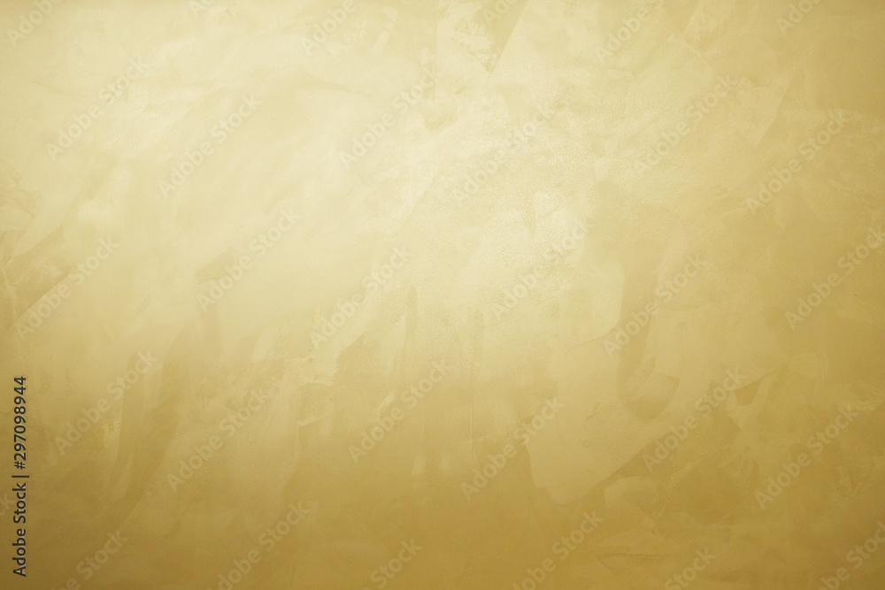 golden decorative plaster texture with glow, photo