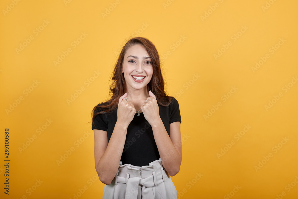 Gorgeous girl showing happiness as she receives very good news. She is jumping off because of joy as she is surprised and amazed both at the same time. Gorgeous girl showing happiness as she receives very good news. She is jumping off because of joy as she is surprised and amazed both at the same time.