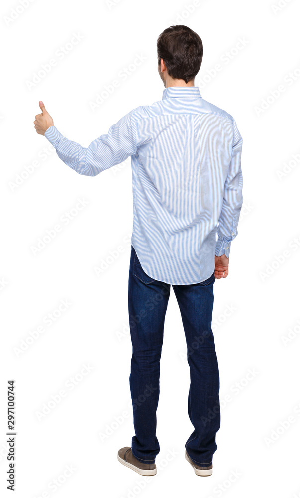 Back view of a man showing thumb up.