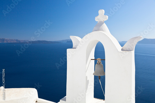 White Bell Tower And Blue Sea