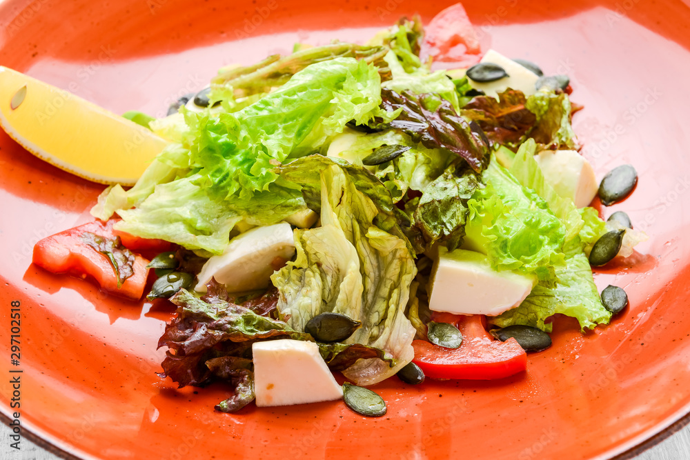 Salad with tomatoes, olives, mozzarella and basil Salad with tomatoes, olives, mozzarella and basil