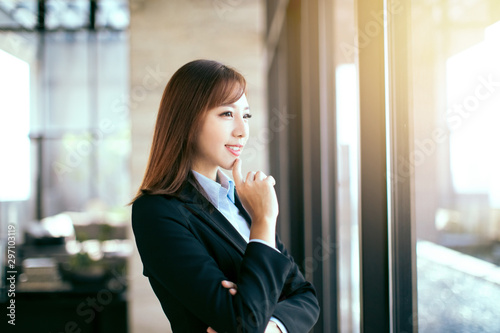 young beautiful business woman standing in office