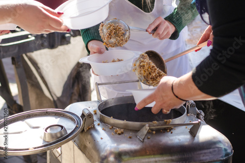 preparing a meal in the kitchen of field and feeds people on the street.
