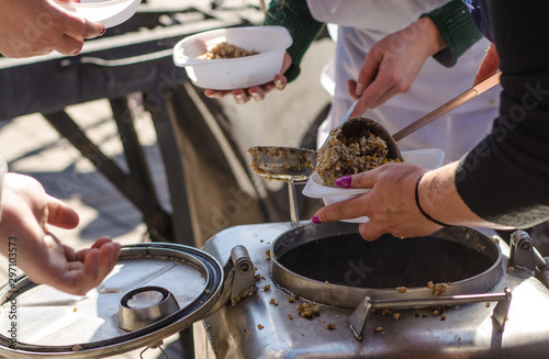 preparing a meal in the kitchen of field and feeds people on the street.