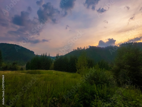 Landscape with Carpathian mountains during the sunset with amazing sunlight