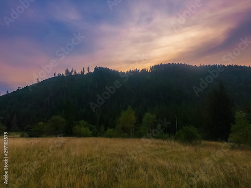 Landscape with Carpathian mountains during the sunset with amazing sunlight