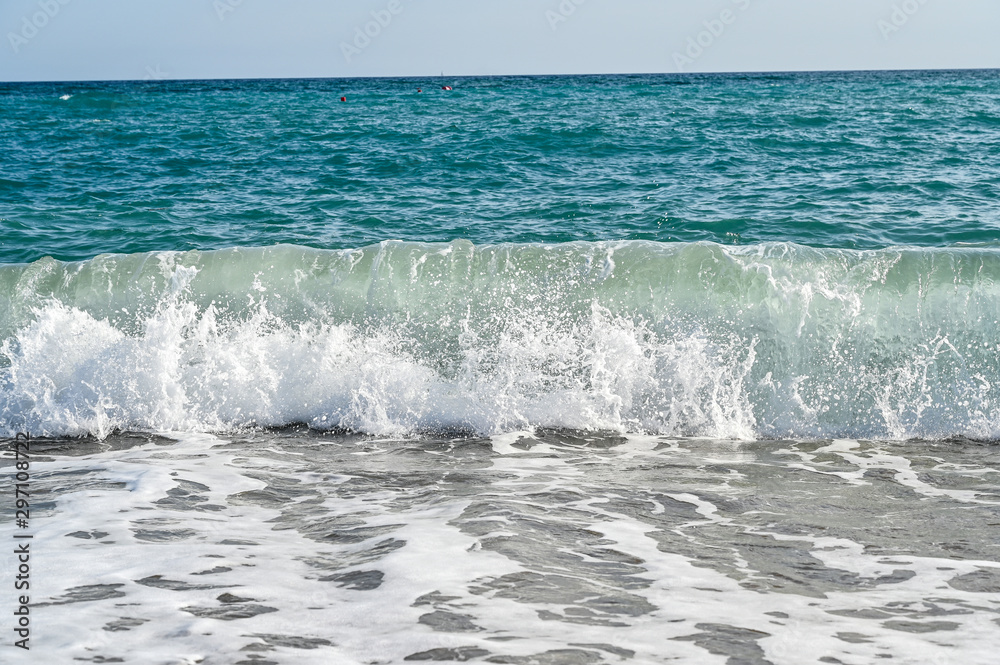waves in mediterranean sea hitting the beach