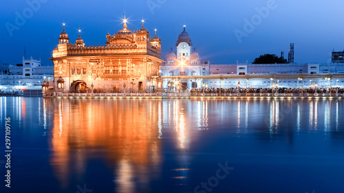 The Harmandir Sahib, also known as the Golden Temple is a Gurdwara in Amritsar, Punjab, India at Night photo