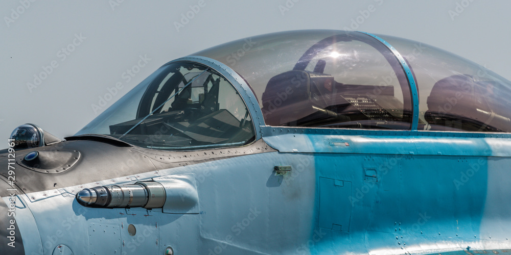 The empty cockpit of a military aircraft